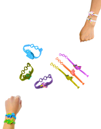 Unicorn and dinosaur silicone bracelets worn by child on wrist
